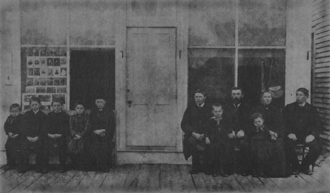 The above is a reproduction from an original photograph of the John M. Rutten family taken in front of the Photograph Gallery in Osakis, Minnesota, soon after their arrival there in 1892.