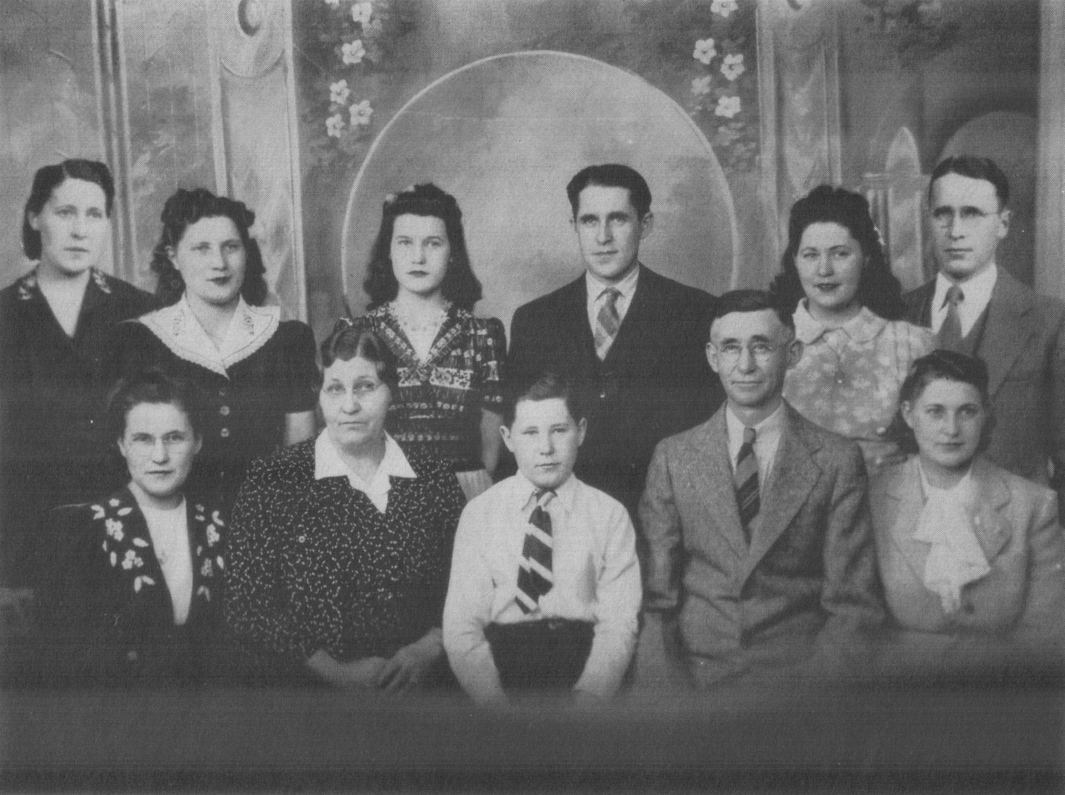 The Peter Rutten Family. Front Row, Left to right—Alice. Agnes (mother), Donald, Peter (father), Mary Back Row—~Pauline, Helen, Irene, Walter, Catherine, Joseph